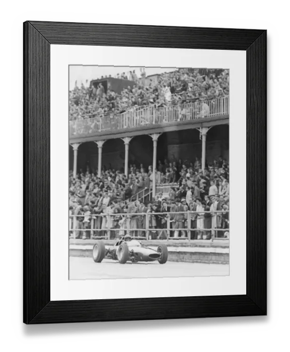 Framed Print : Graham Hill Grand Prix Motor Racing Driver April 1963 driving his car past the main Framed Print : Graham Hill Grand Prix Motor Racing Driver April 1963 driving his car past the main