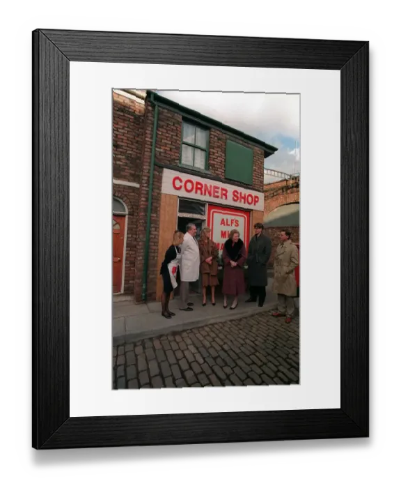 Framed Print : Prime Minister Margaret Thatcher at Granada TV on the Coronation Street set with some of
