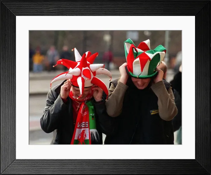 Framed Print : Edinburgh weather 4th February 1999 Welsh fans holding on to their hats Framed Print : Edinburgh weather 4th February 1999 Welsh fans holding on to their hats