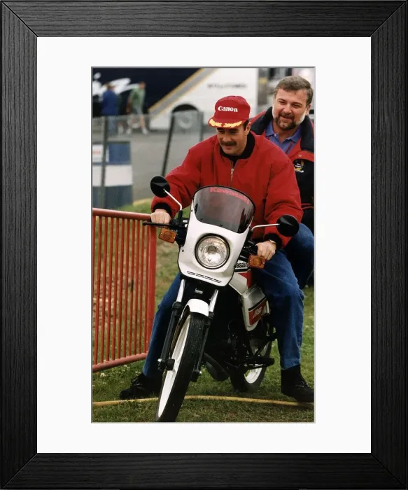 Framed Print : Nigel Mansell Motor Racing Driver Formula One F1 riding a Motor Cycle Framed Print : Nigel Mansell Motor Racing Driver Formula One F1 riding a Motor Cycle