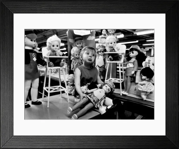 Framed Print : Kathleen Makeham with a selection of dolls at the end of the factory production line Framed Print : Kathleen Makeham with a selection of dolls at the end of the factory production line