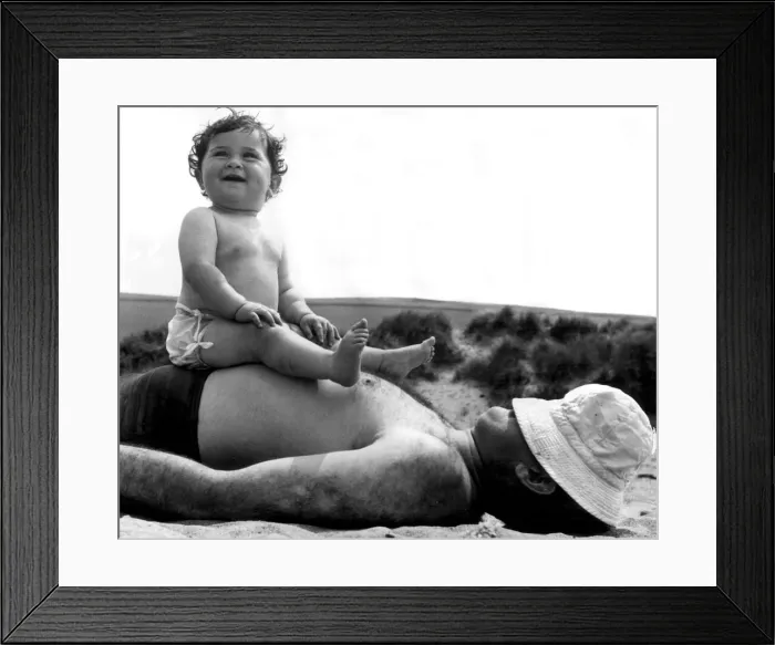 Framed Print : Father and daughter on the beach at Bantham, Devon. 31st May 1954 Framed Print : Father and daughter on the beach at Bantham, Devon. 31st May 1954