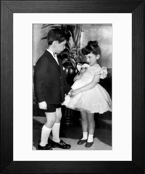 Framed Print : Young boy and girl holding hands. 2nd June 1958 Framed Print : Young boy and girl holding hands. 2nd June 1958