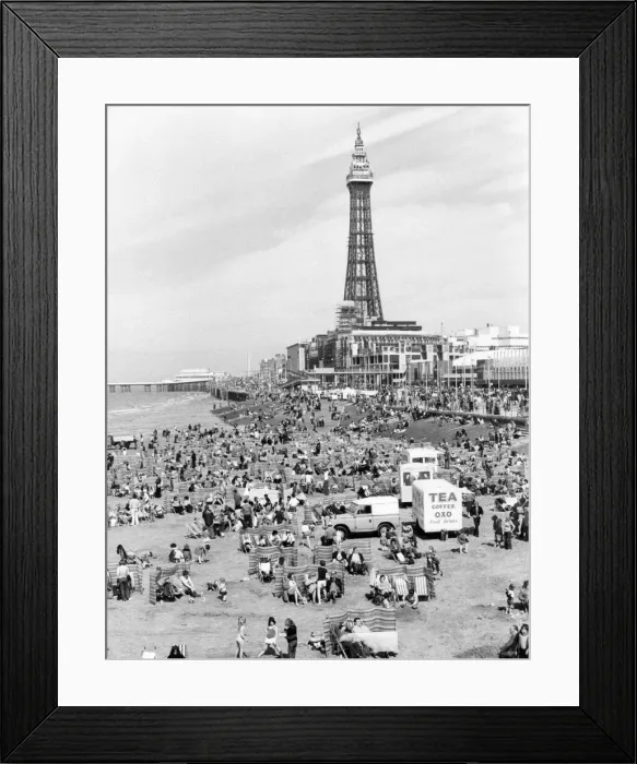 Framed Print : Blackpool Tower with people sitting on Blackpool Beach Framed Print : Blackpool Tower with people sitting on Blackpool Beach