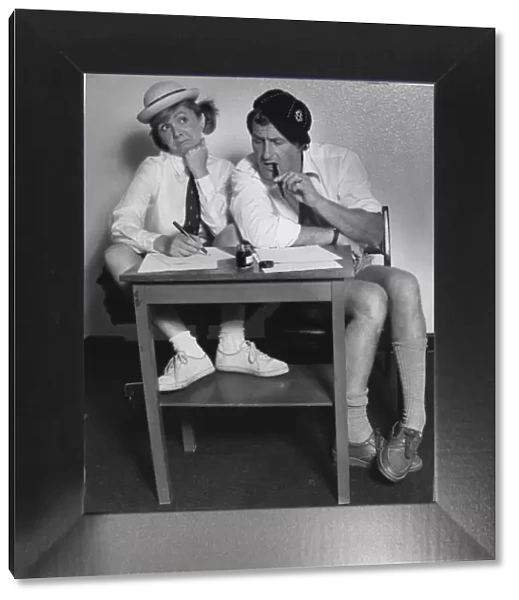 Two adults seen here dressed as school children for O Level feature. 22nd August 1954