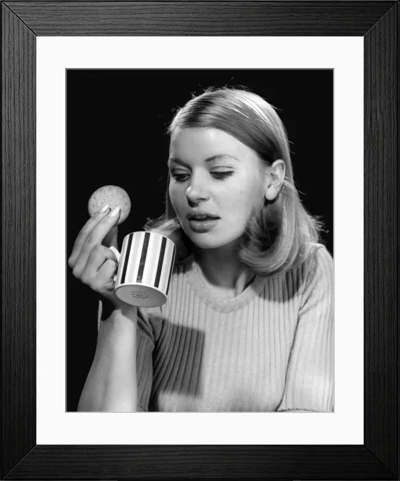 Framed Print : Young office worker having a coffee break at work. 2nd November 1967 Framed Print : Young office worker having a coffee break at work. 2nd November 1967