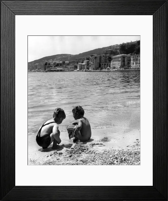 Framed Print : Young boy and girl playing on the beach at Villefranche, Alpes Maritime, France Framed Print : Young boy and girl playing on the beach at Villefranche, Alpes Maritime, France