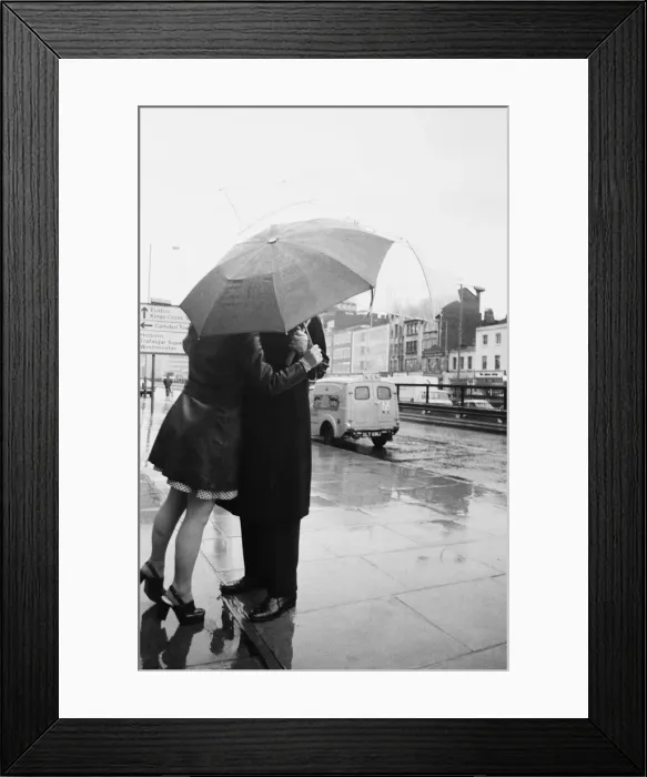 Framed Print : Dr Michael Ramsey, the Archbishop of Canterbury is given a birthday kiss by Bank clerk Framed Print : Dr Michael Ramsey, the Archbishop of Canterbury is given a birthday kiss by Bank clerk