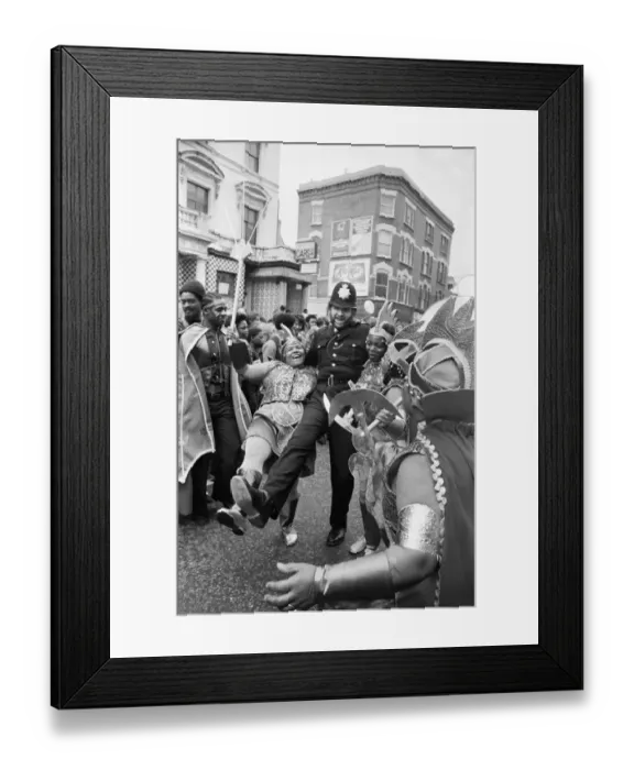 Framed Print : A policeman dances with a woman in costume at Notting Hill carnival Framed Print : A policeman dances with a woman in costume at Notting Hill carnival
