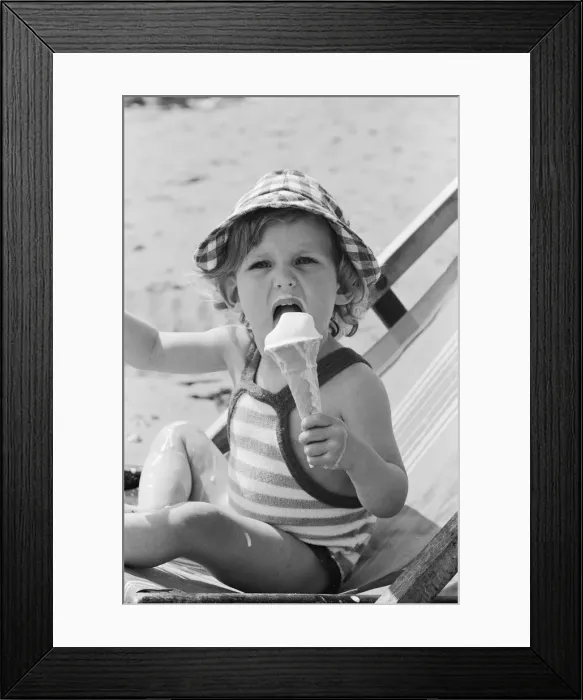 Framed Print : Eighteen month old Nicola England from Bromley, Kent enjoys an ice cream on the beach Framed Print : Eighteen month old Nicola England from Bromley, Kent enjoys an ice cream on the beach