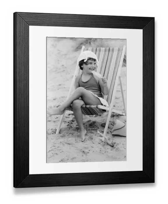 Framed Print : Four year old Joanna Weaver of Fordcombe, Kent enjoys an ice lolly as she sits in a deck Framed Print : Four year old Joanna Weaver of Fordcombe, Kent enjoys an ice lolly as she sits in a deck