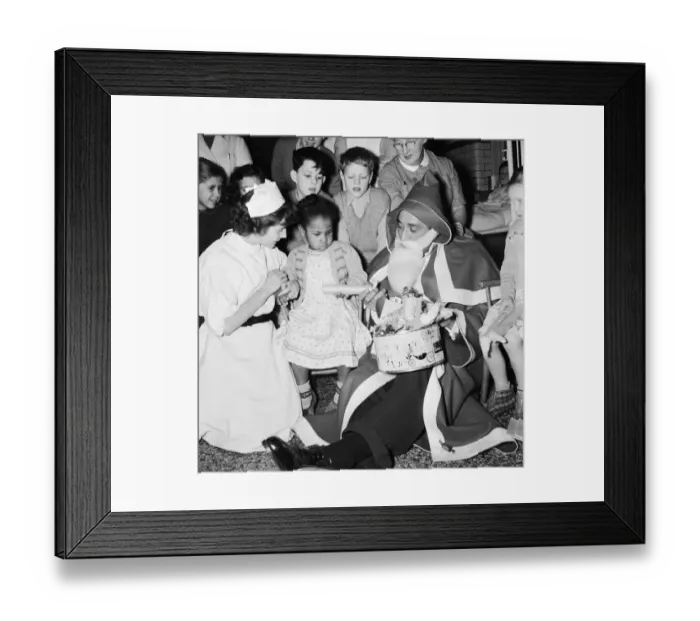 Framed Print : English musician Ray Ellington dressed as Santa Claus at the Paddington Green Hospital