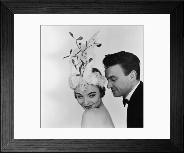 Framed Print : A model posing in the studio, wearing a Christmas bonnet designed by Madge Ehard