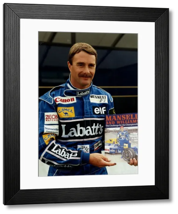 Framed Print : Nigel Mansell Motor Racing Grand Prix Formula One Driver holding a copy of his magazine