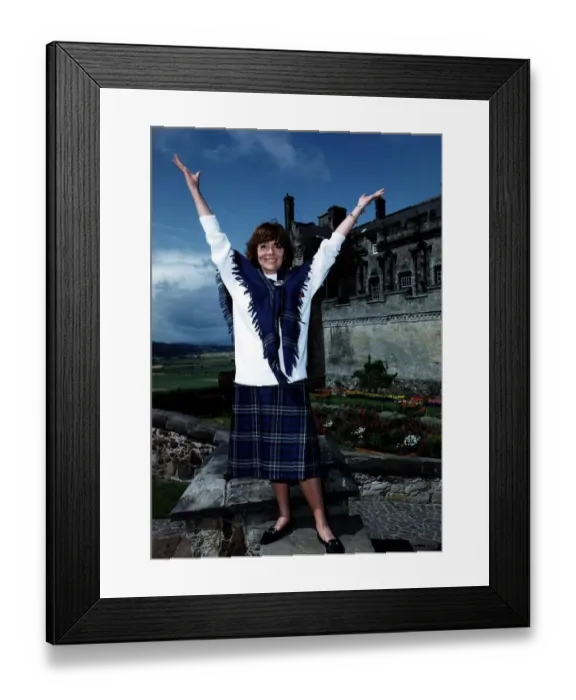 Framed Print : Diana Rigg actress Stirling Castle Scottish Rugby Union tartan skirt shawl arms raised Framed Print : Diana Rigg actress Stirling Castle Scottish Rugby Union tartan skirt shawl arms raised
