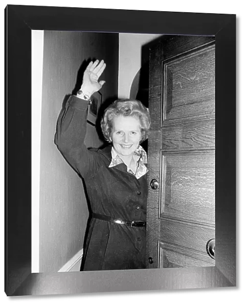 Conservative politician Margaret Thatcher waves at the front door of her home May