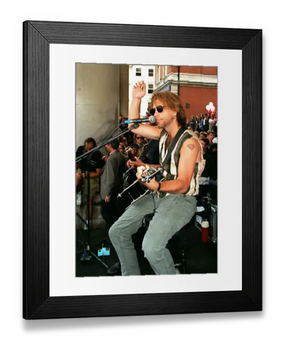Framed Print : Jon Bon Jovi pop star busking in Covent Garden to the crowds Playing