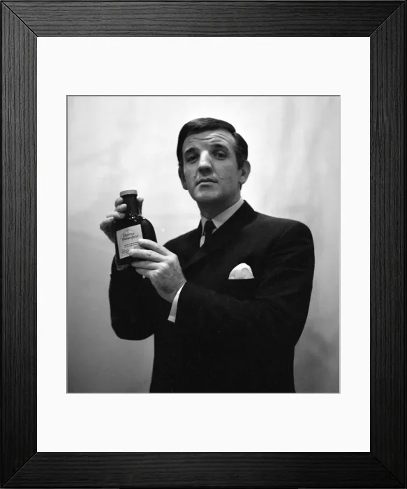 Framed Print : Radio DJ Alan Freeman holding a bottle of Mersey water February 1964 Framed Print : Radio DJ Alan Freeman holding a bottle of Mersey water February 1964