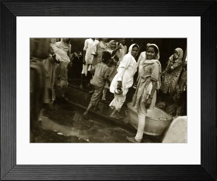 Framed Print : A street scene in India - Women going about doing their daily tasks wearing traditional Framed Print : A street scene in India - Women going about doing their daily tasks wearing traditional