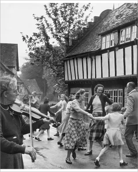 Village Fete. Miss Isabella Geddis plays her 200 year old fiddle for the residents of