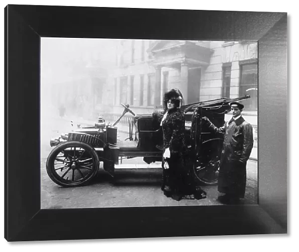 Woman and her chauffeur in the early 1900s