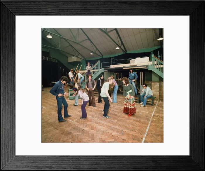 Framed Print : Richard Gere as Danny Zuko (left) seen here in rehearsal with the rest of the cast of
