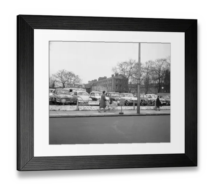 Framed Print : A woman and a pram pass a deserted second hand car lot in the Kings Road Chelsea Framed Print : A woman and a pram pass a deserted second hand car lot in the Kings Road Chelsea