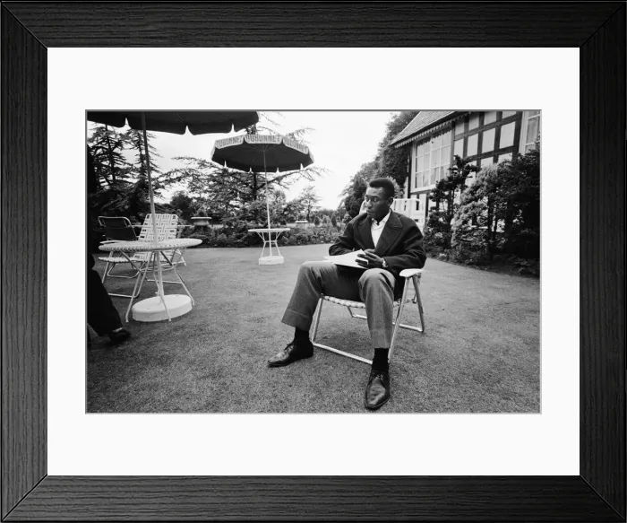 Framed Print : Brazilian football star Pele relaxes in an English country garden at the Brazilian team