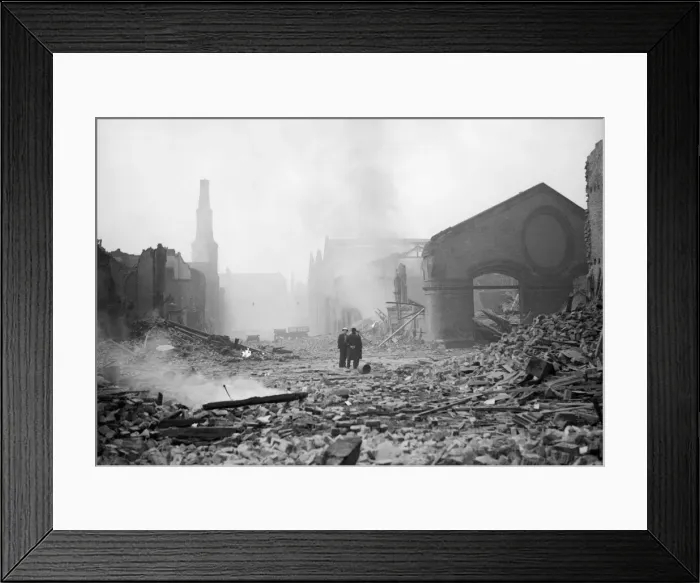 Framed Print : Bomb damage at Liverpool. Two people survey the damage caused by an air raid Framed Print : Bomb damage at Liverpool. Two people survey the damage caused by an air raid