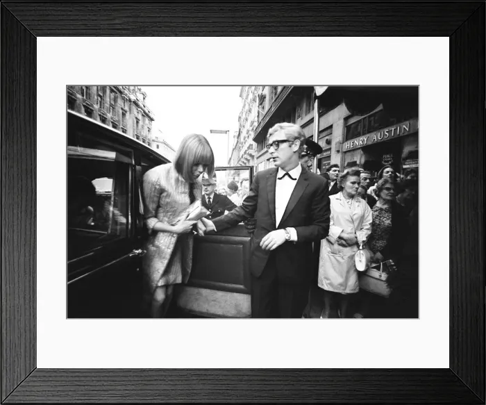 Framed Print : Harlow film premiere. Michael Caine arrives with Lucianna Paluzzi Framed Print : Harlow film premiere. Michael Caine arrives with Lucianna Paluzzi