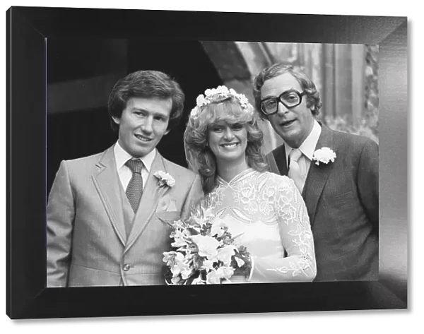 Actor Michael Caine stands with his daughter Niki and her groom showjumper Rowland