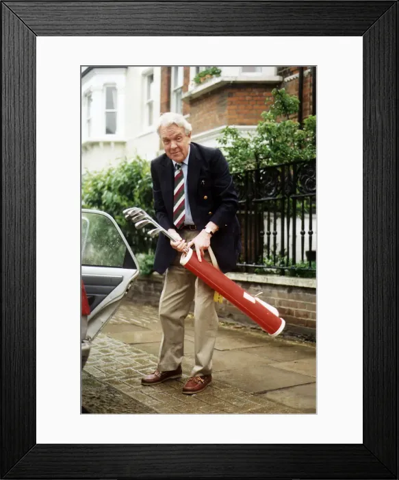 Framed Print : Sir Nicholas Scott MP holding golf clubs Framed Print : Sir Nicholas Scott MP holding golf clubs