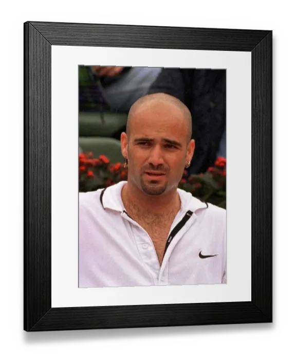 Framed Print : Andre Agassi tennis star in action in the rain during the French Open tennis tournament Framed Print : Andre Agassi tennis star in action in the rain during the French Open tennis tournament