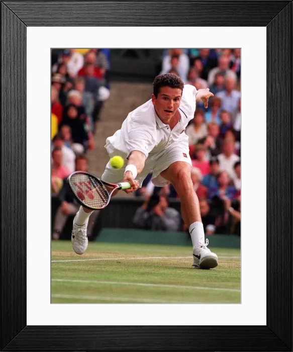 Framed Print : Richard Krajicek stretches for the ball against MaliVai Washington in the mens final Framed Print : Richard Krajicek stretches for the ball against MaliVai Washington in the mens final