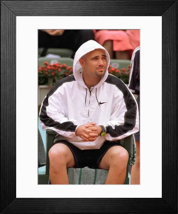 Framed Print : Andre Agassi tennis star in action in the rain during the French Open tennis tournament Framed Print : Andre Agassi tennis star in action in the rain during the French Open tennis tournament