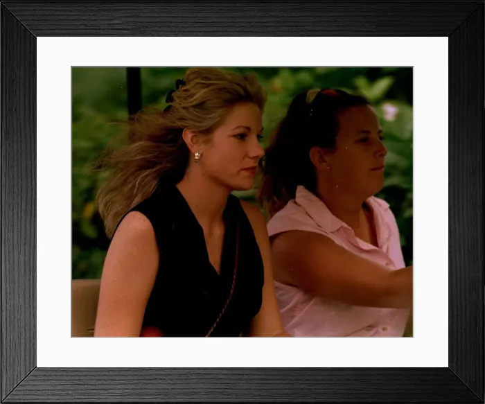 Framed Print : Nick Faldos new girlfriend Brenna gets a lift from his caddie Fanny