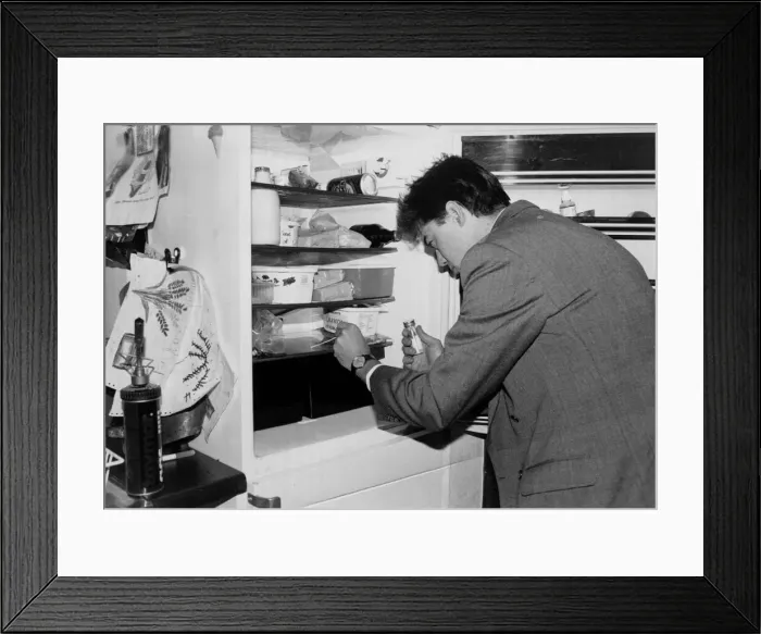 Framed Print : A man applies a swab test as he checks his fridge for bugs march 1991 Framed Print : A man applies a swab test as he checks his fridge for bugs march 1991