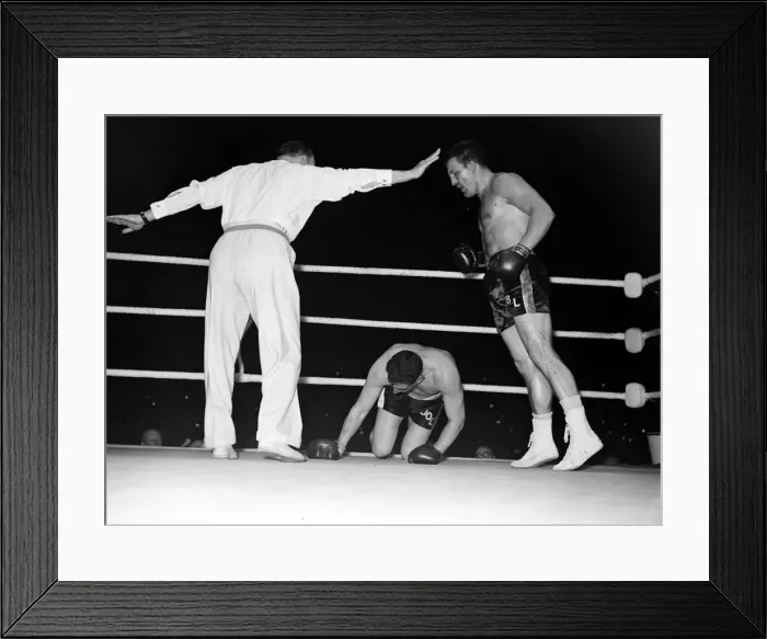 Framed Print : Brian London towers over Welshman Joe Erskin as the referee waves away London in their