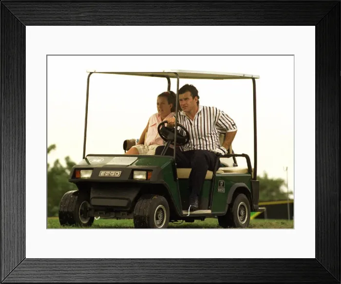 Framed Print : Nick Faldo gives his caddie Fanny a lift in a golf car in Jamaica Framed Print : Nick Faldo gives his caddie Fanny a lift in a golf car in Jamaica
