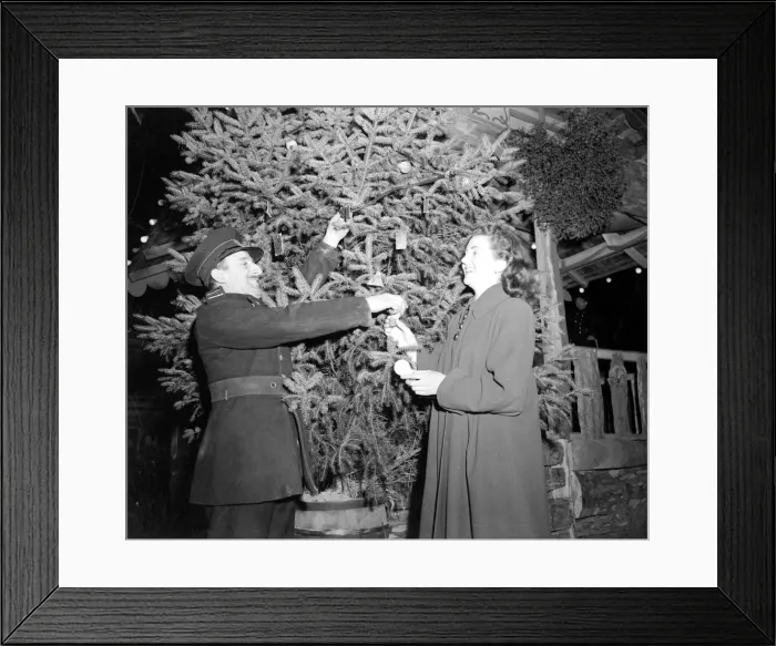 Framed Print : A fireman helping to arrange the lights on the borough Framed Print : A fireman helping to arrange the lights on the borough