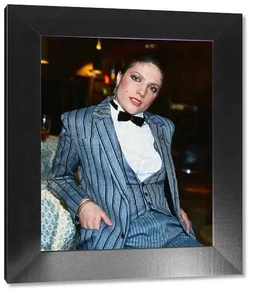 Suzanne Danielle actress March 1982 wearing grey black striped suit white shirt