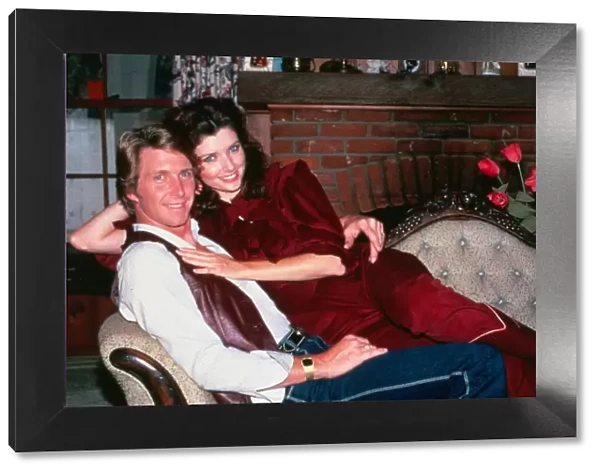 Morgan Brittany actress July 1983 sitting on couch with her husband