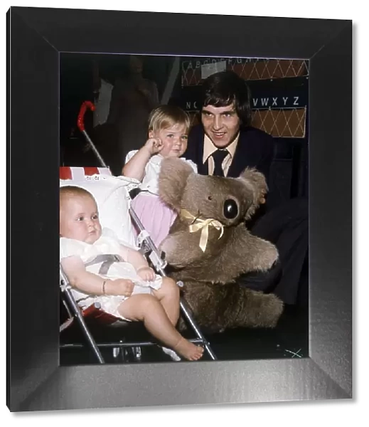 Rangers and Scotland footballer Tom Forsyth at the airport with his two daughters