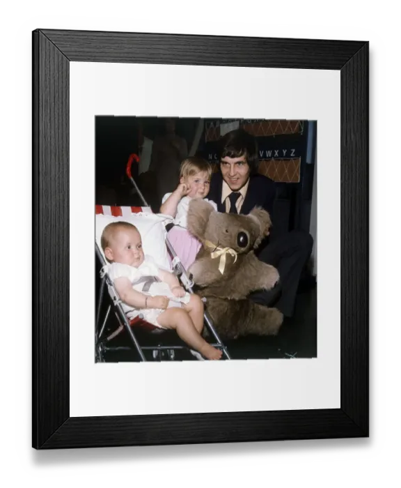 Framed Print : Rangers and Scotland footballer Tom Forsyth at the airport with his two daughters