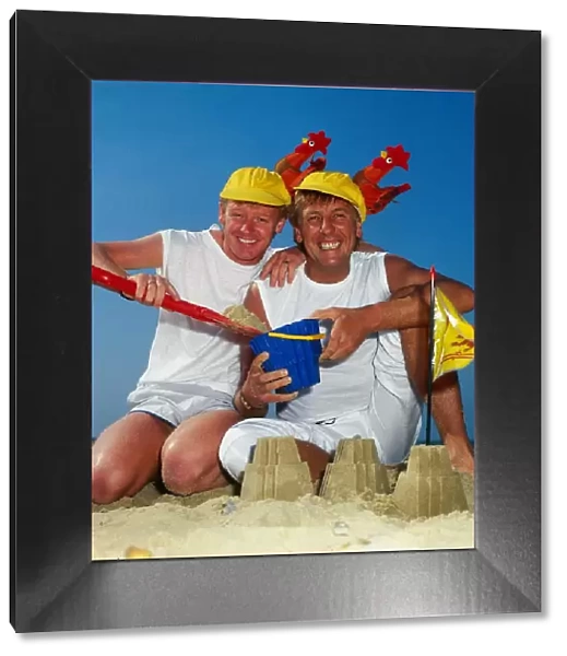 Dustin Gee on the beach with fellow comediy partner Les Dennis, 1985