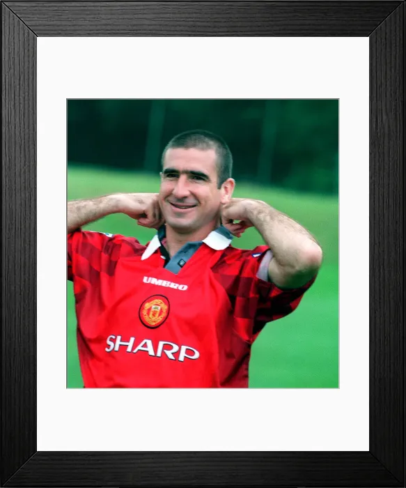 Framed Print : Manchester Utd new home strip launch with Eric Cantona feeling his collar