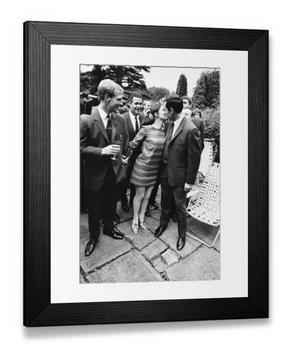 Framed Print : Gordon Banks gives a kiss to actress Vivienne Ventura watched by Ron Flowers during Framed Print : Gordon Banks gives a kiss to actress Vivienne Ventura watched by Ron Flowers during