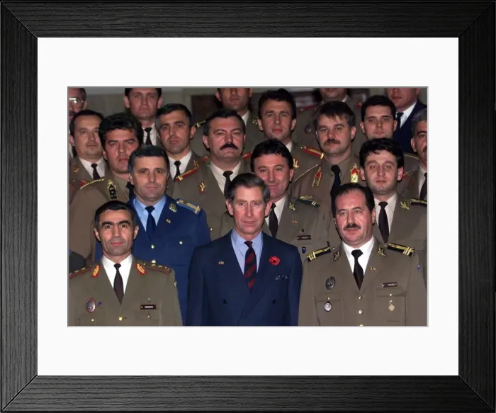 Framed Print : Prince Charles wearing a blue suit with poppy stands among officers Framed Print : Prince Charles wearing a blue suit with poppy stands among officers