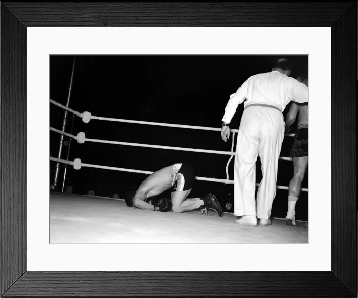 Framed Print : Joe Lopes crumples in a heap after Charley caught him with a right