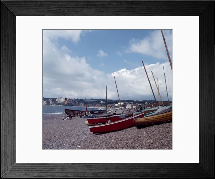 Framed Print : Boats on the beach in the small seaside town of Seaton on the South Devon coast